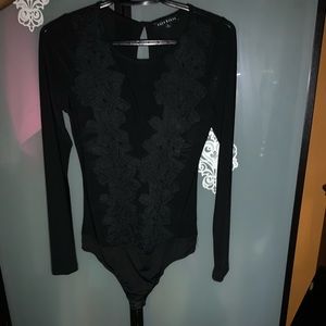 Beautiful black bodysuit with lace flower accent
